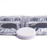 Taking too many painkillers can lead to a worsening of pain caled medication overuse headache. A picture of an Aspirin Tablet.