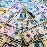 image of dollar bills - manage migraine on a budget.